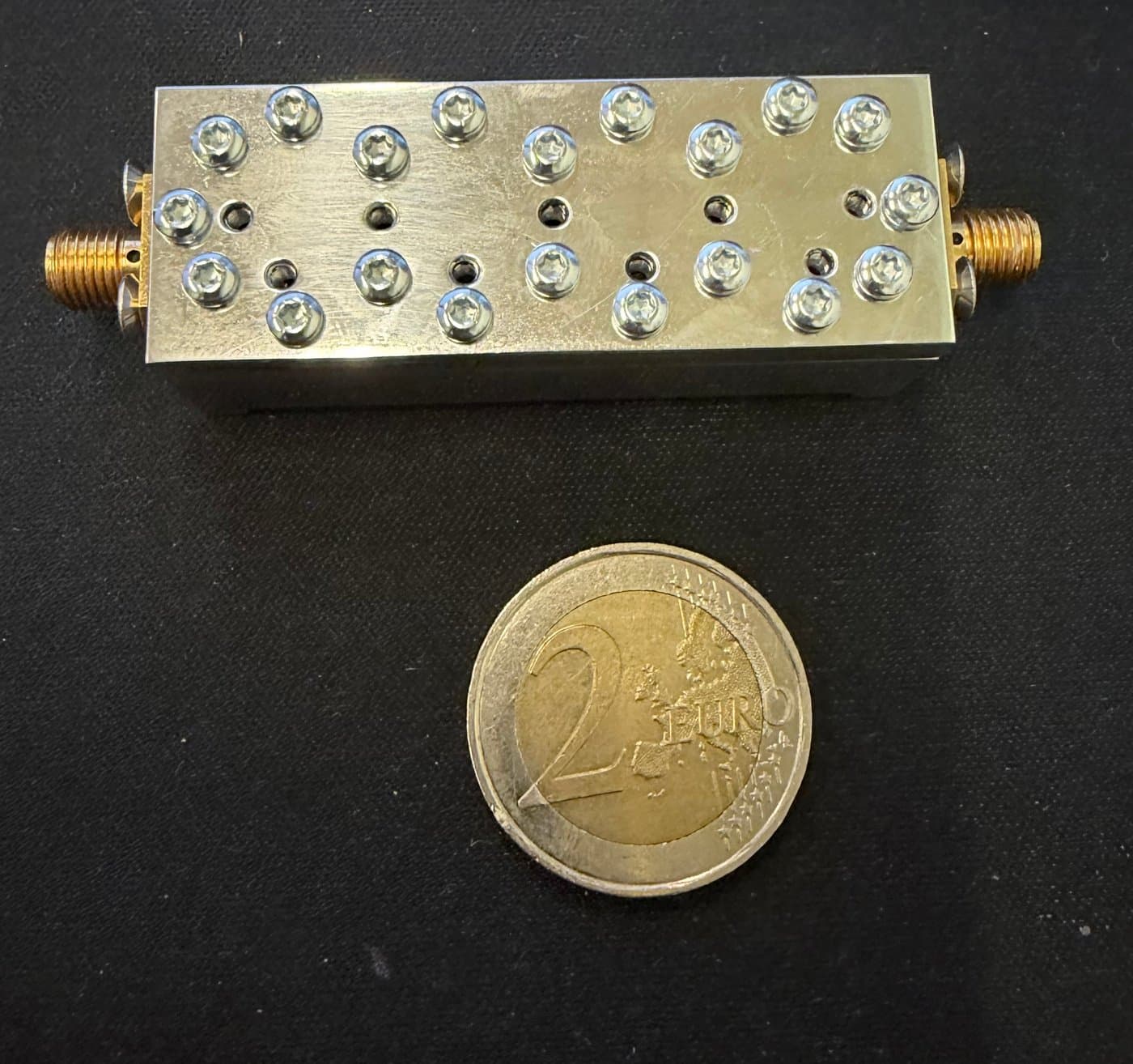 C-band narrowband filter next to a 2-euro coin